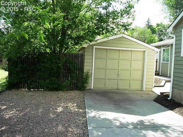 714 Prairie Road, Unit A & #B Colorado Springs, CO 80909 - Photo 2 of 22 Single detached garage with service door.