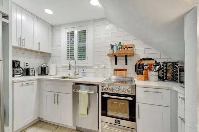 a dining room with furniture and a chandelier