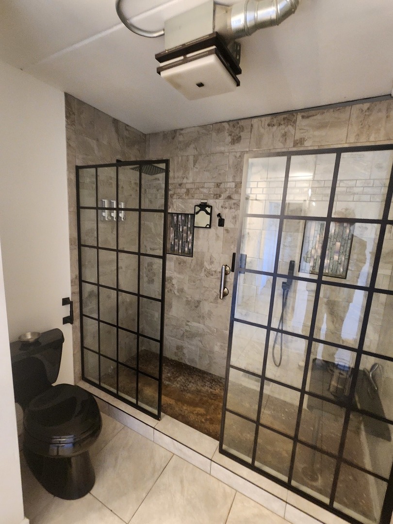 1503 Kenneth Circle Elgin, IL 60120 - Photo 11 of 18 a bathroom with a shower