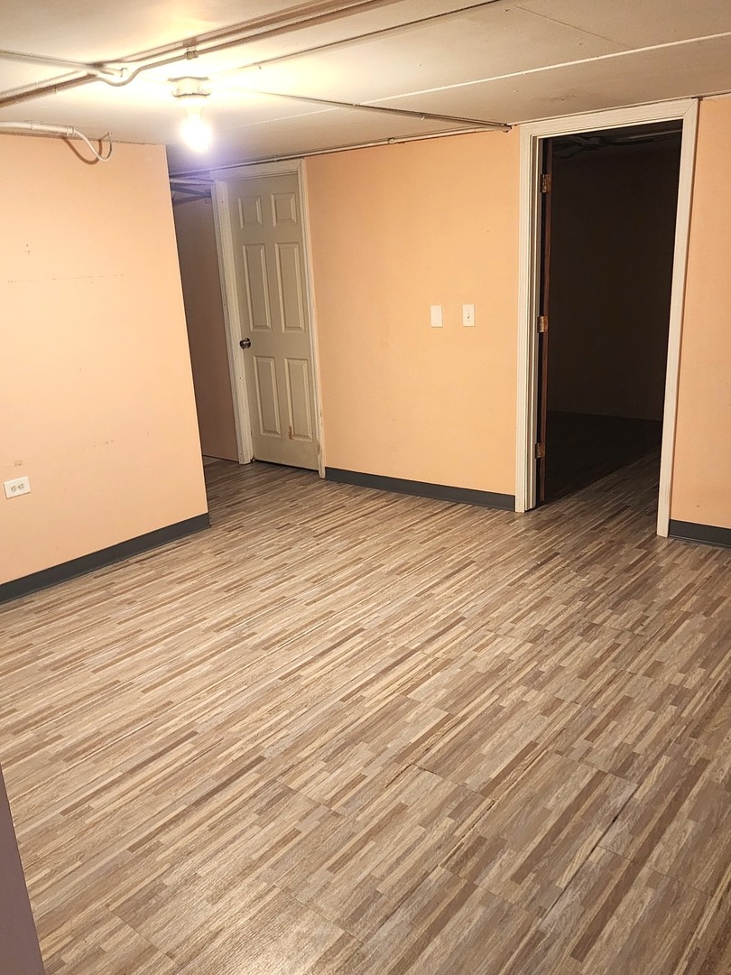 1503 Kenneth Circle Elgin, IL 60120 - Photo 15 of 18 a view of a room with wooden floor