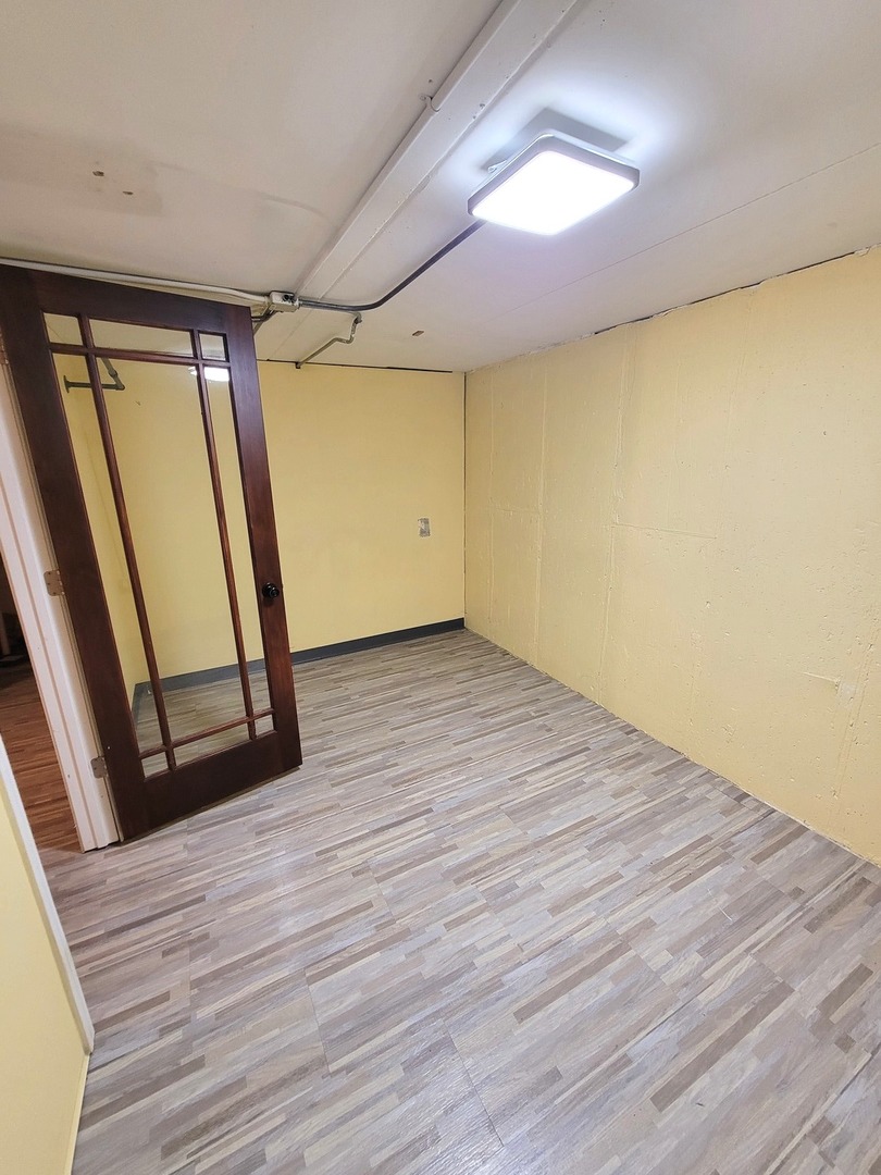 1503 Kenneth Circle Elgin, IL 60120 - Photo 17 of 18 a view of empty room with wooden floor