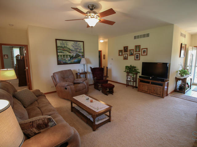3617 East 1759th Road Ottawa, IL 61350 - Photo 5 of 20 a living room with furniture and a flat screen tv