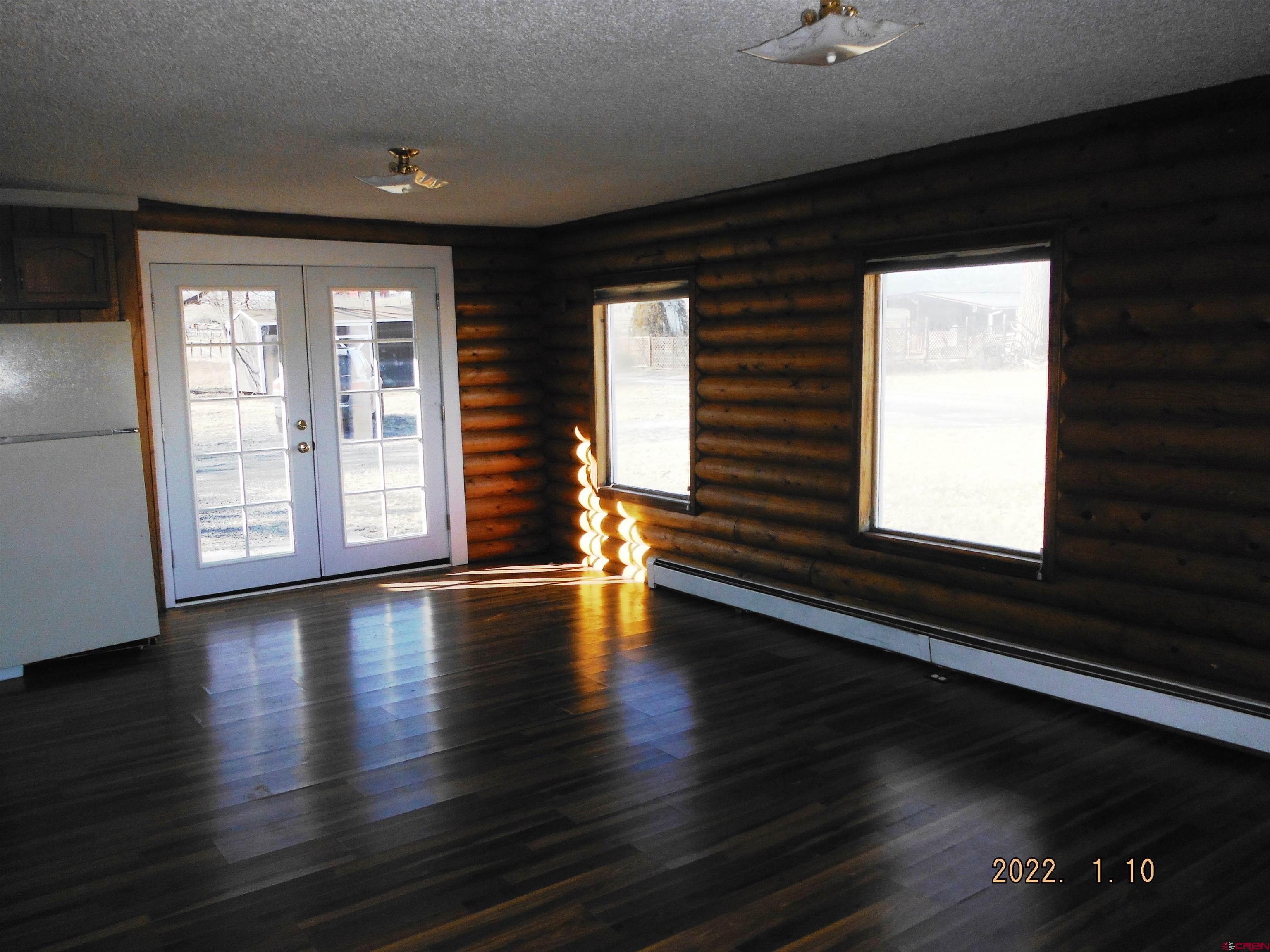 10025 2100th Road Austin, CO 81410 - Photo 5 of 10 a view of empty room with wooden floor and fan