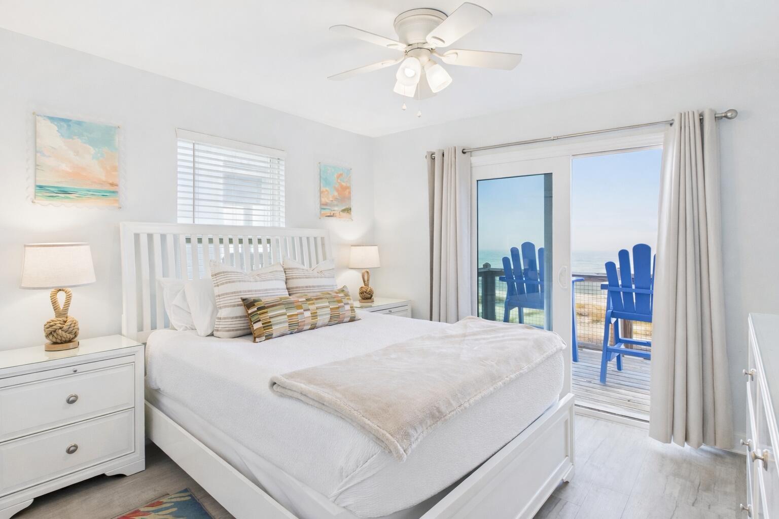 5191 Clipper Way Port St. Joe, FL 32456 - Photo 12 of 23 a bedroom with a bed and a chandelier