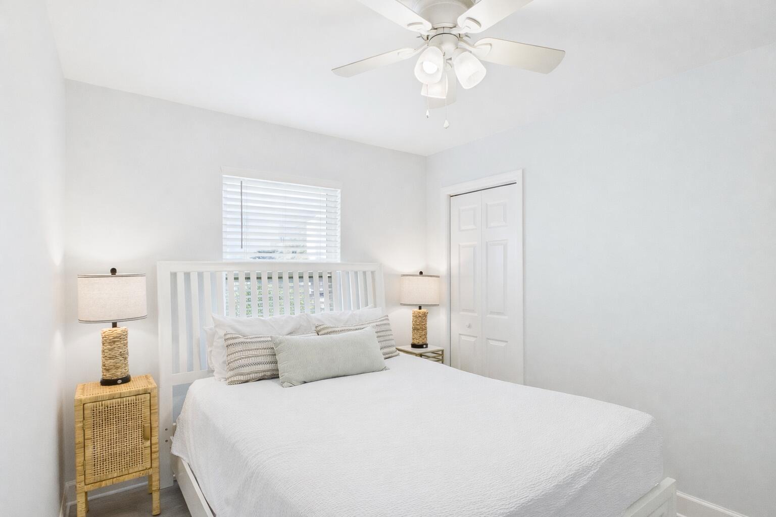 5191 Clipper Way Port St. Joe, FL 32456 - Photo 14 of 23 a bedroom with a bed and a chandelier