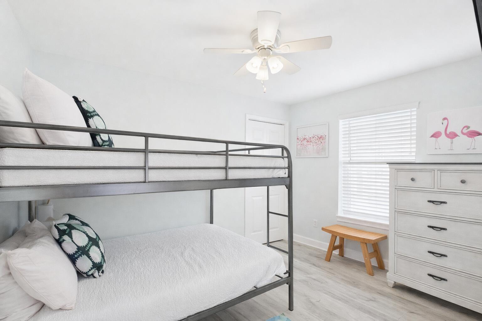 5191 Clipper Way Port St. Joe, FL 32456 - Photo 15 of 23 a bedroom with a bed and a dresser