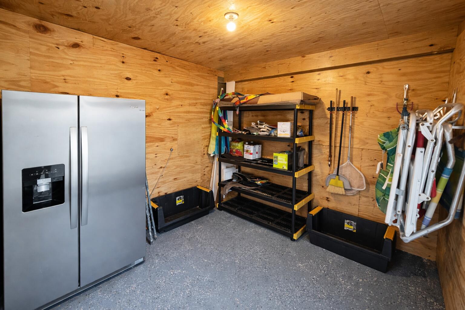 5191 Clipper Way Port St. Joe, FL 32456 - Photo 22 of 23 a bedroom with a bed and a refrigerator