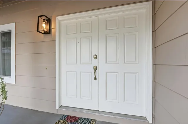 a view of an entryway with front door