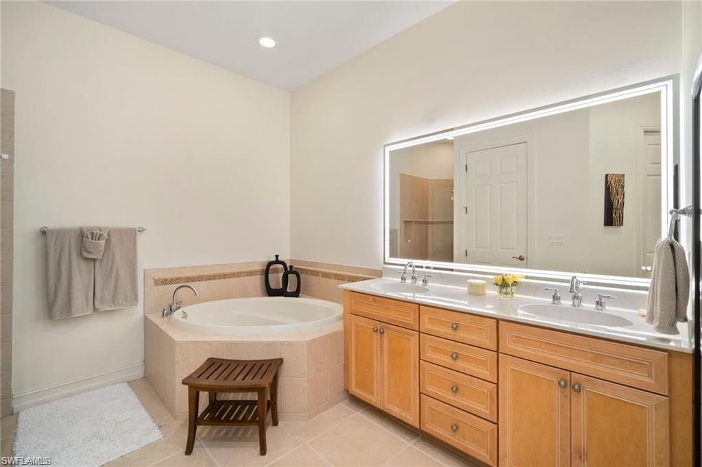 8519 Chase Preserve Drive Naples, FL 34113 - Photo 13 of 29 a bathroom with a sink and a mirror