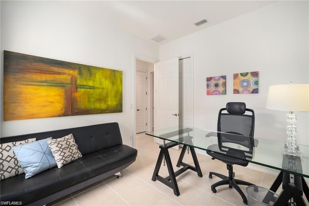 8519 Chase Preserve Drive Naples, FL 34113 - Photo 15 of 29 a living room with furniture and a window