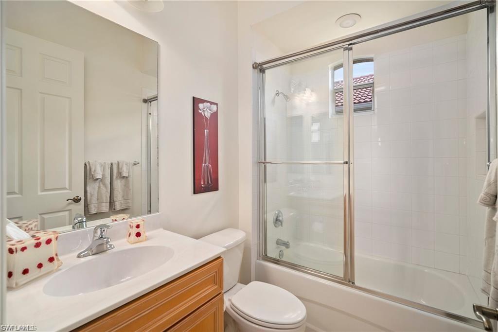 8519 Chase Preserve Drive Naples, FL 34113 - Photo 17 of 29 a bathroom with a sink toilet and shower
