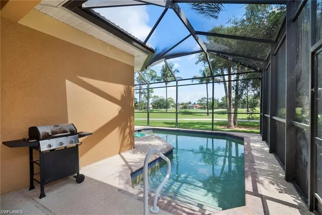 a view of a patio with a table chairs and backyard