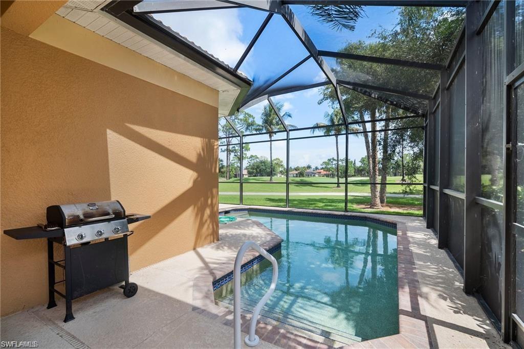 8519 Chase Preserve Drive Naples, FL 34113 - Photo 20 of 29 a view of a patio with a table chairs and backyard