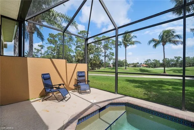 a view of a backyard with sitting area