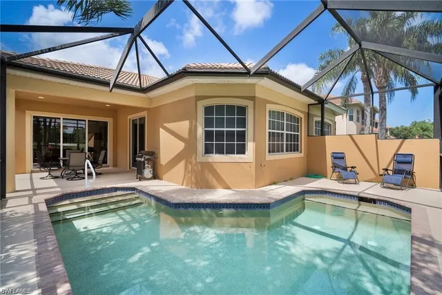 a view of a house with swimming pool