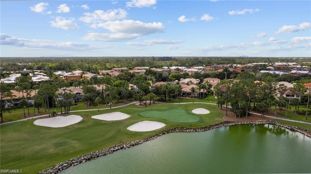 8519 Chase Preserve Drive Naples, FL 34113 - Photo 26 of 29 a view of a lake with a city