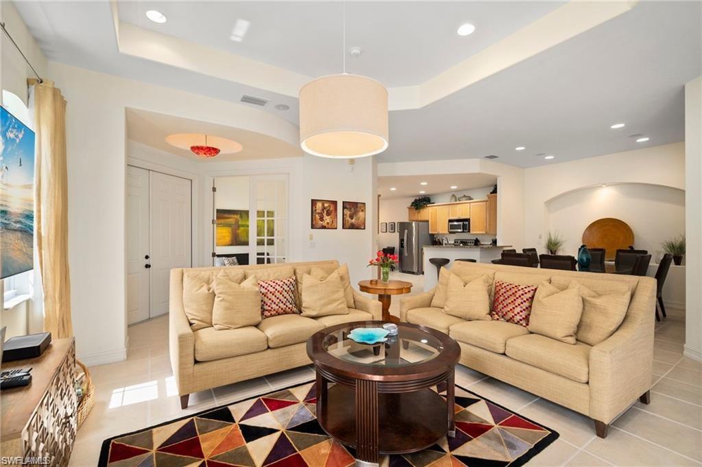 8519 Chase Preserve Drive Naples, FL 34113 - Photo 6 of 29 a living room with furniture and a rug