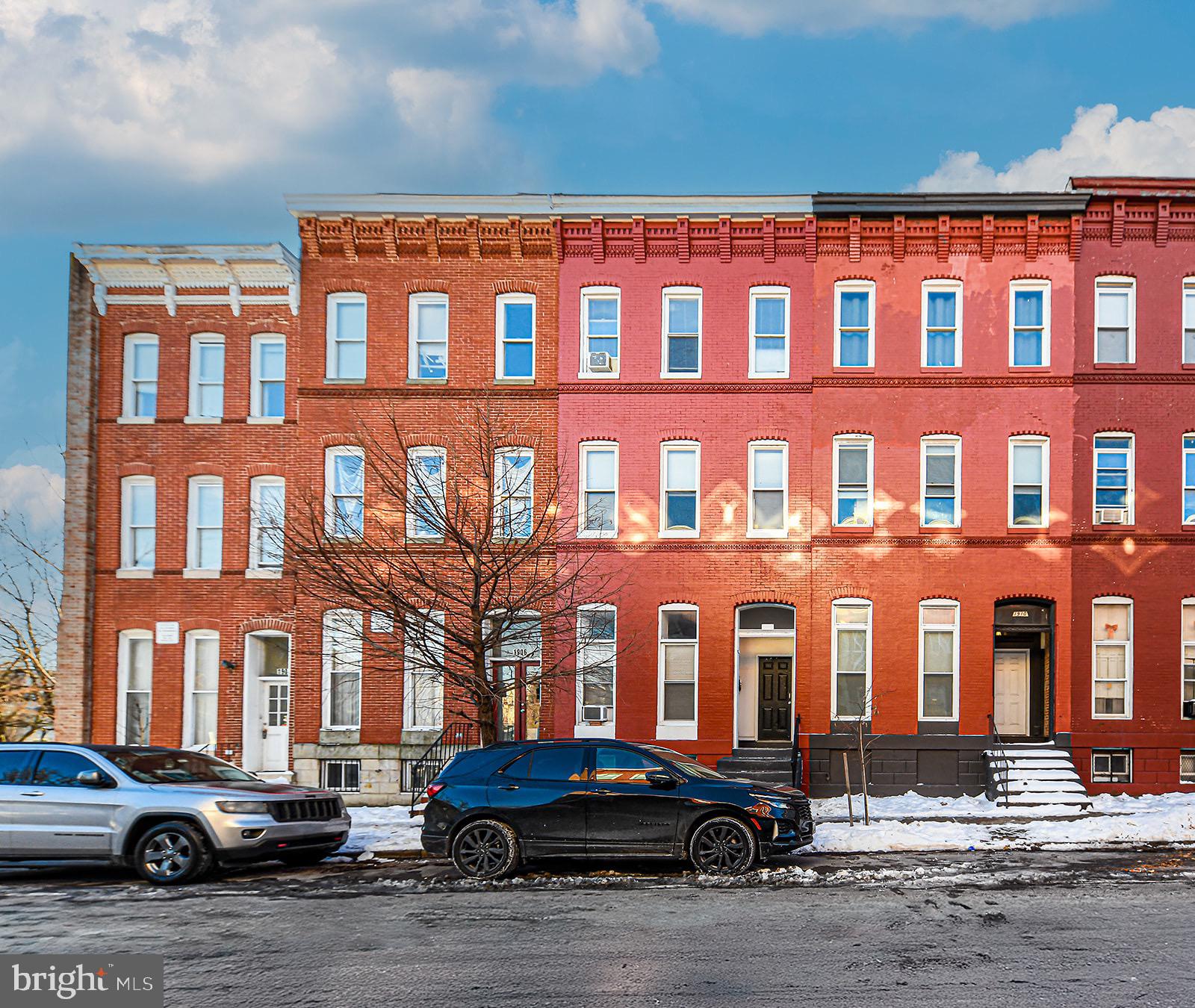 1908 McCulloh Street, Unit 1 Baltimore, MD 21217 - Photo 24 of 24 a front view of a building with lot of cars parked