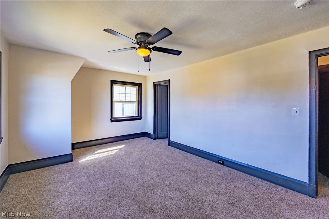 3254 Redwood Road Cleveland Heights, OH 44118 - Photo 36 of 49 Carpeted empty room with ceiling fan