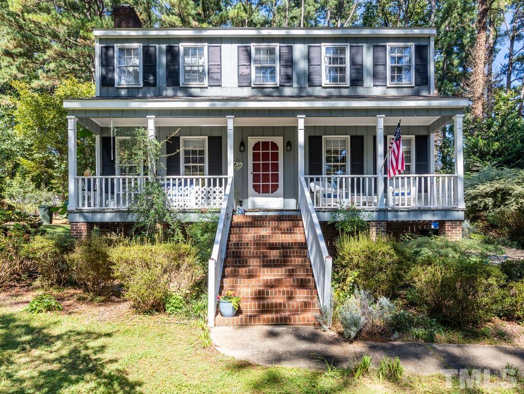 5808 Heatherbrook Circle Raleigh, NC 27612 - Photo 1 of 26 a front view of a house with yard