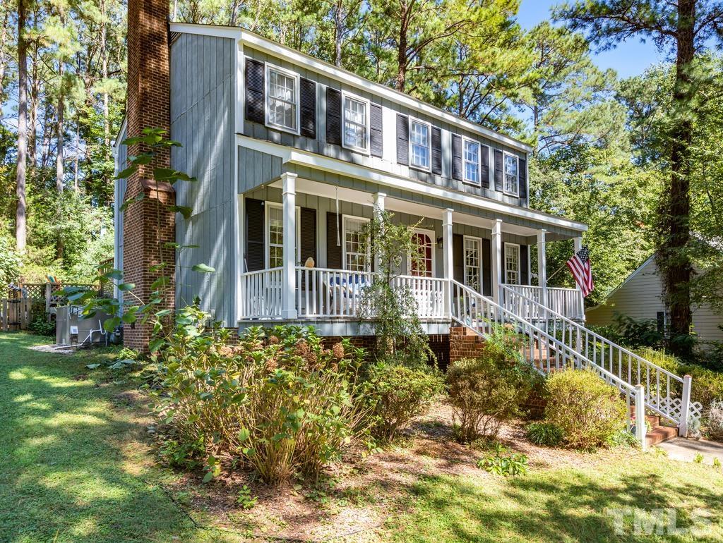 5808 Heatherbrook Circle Raleigh, NC 27612 - Photo 3 of 26 a front view of a house with a garden