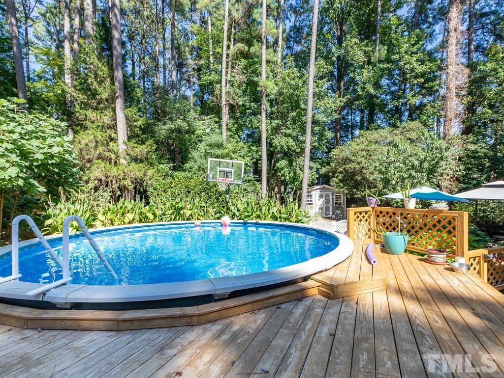 5808 Heatherbrook Circle Raleigh, NC 27612 - Photo 24 of 26 a view of a swimming pool with a patio