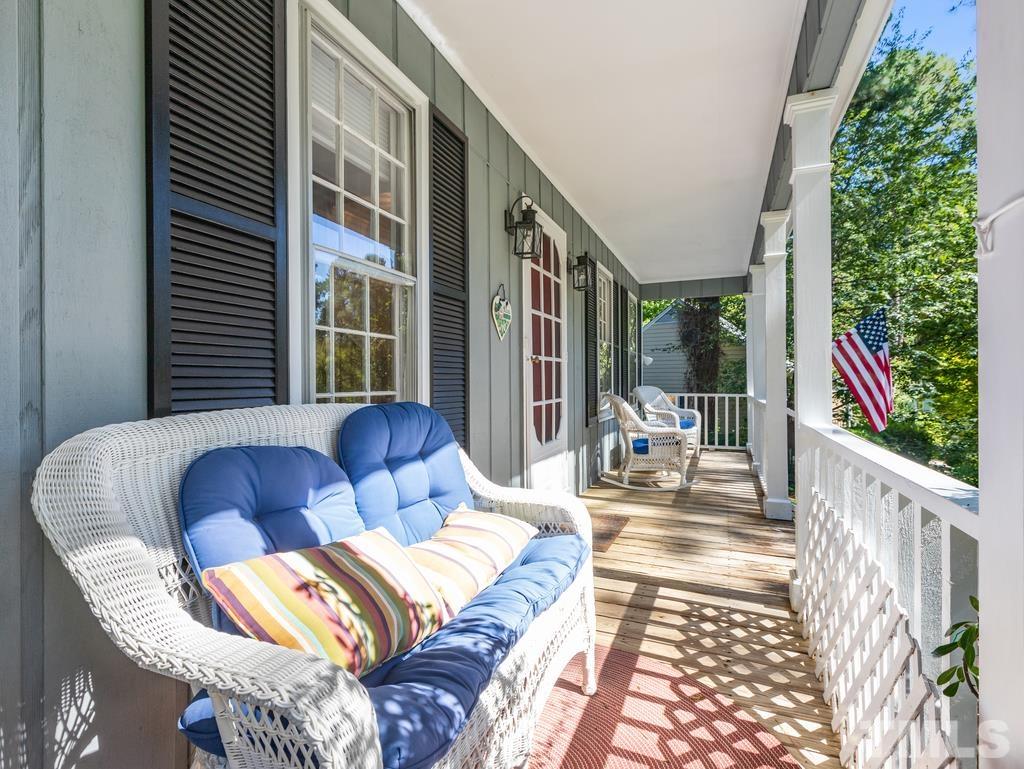 5808 Heatherbrook Circle Raleigh, NC 27612 - Photo 4 of 26 a outdoor living area with furniture and a garden
