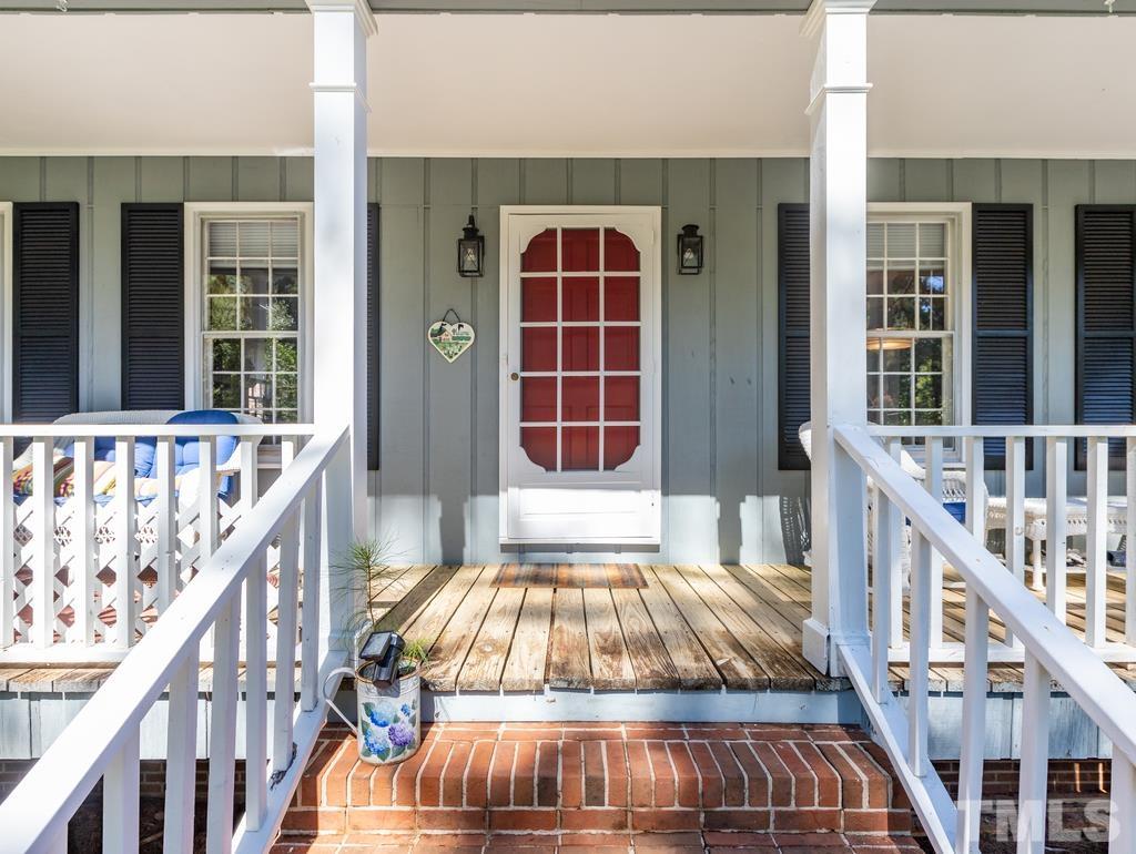 5808 Heatherbrook Circle Raleigh, NC 27612 - Photo 5 of 26 a view of balcony with two chairs and a barbeque
