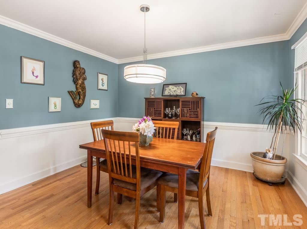 5808 Heatherbrook Circle Raleigh, NC 27612 - Photo 8 of 26 a view of a dining room with furniture window and wooden floor