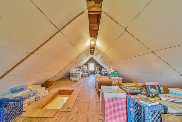 a view of a balcony with wooden floor and outdoor seating