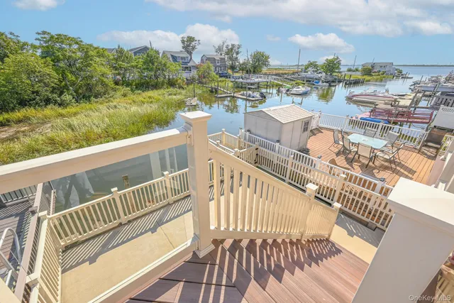 a view of a balcony with wooden floor