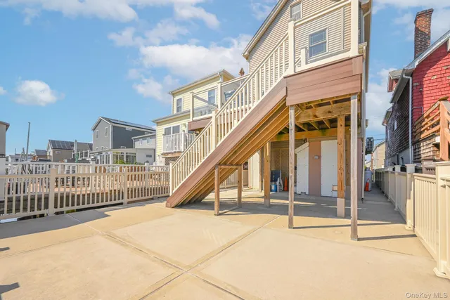 a view of a backyard with wooden fence