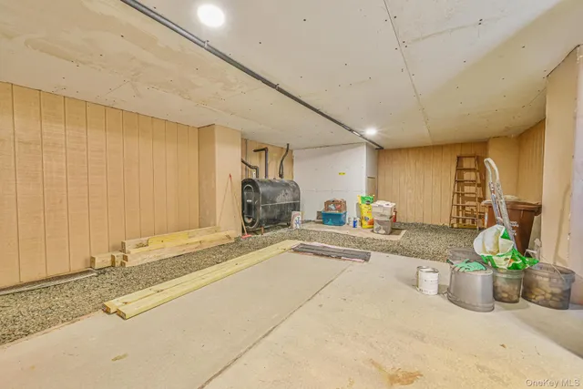 a view of a swimming pool with a lawn chairs and plants