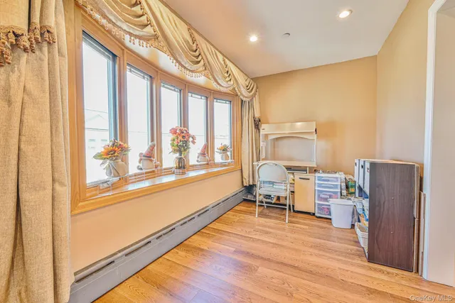 a view of a living room with furniture and a window