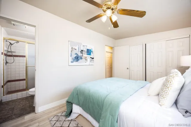 a bathroom with a sink a mirror and a shower