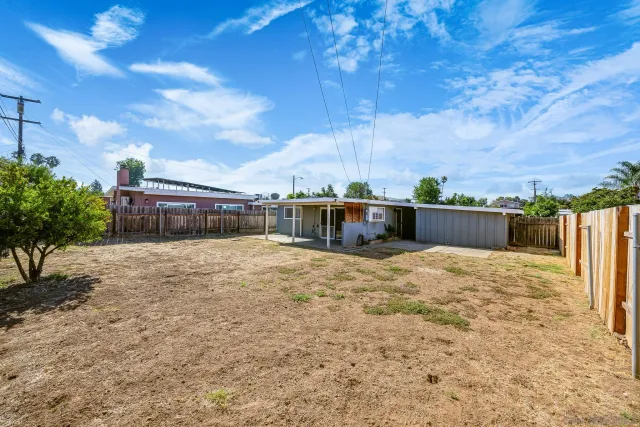 a view of a house with basketball court