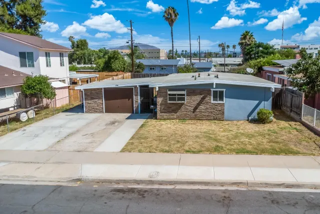 an aerial view of a house with swimming pool