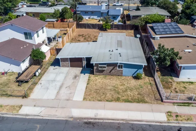 an aerial view of houses with outdoor space