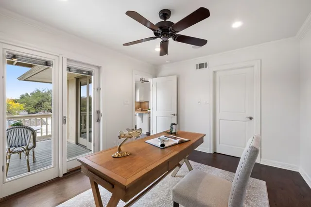 a view of a workspace with furniture and a table