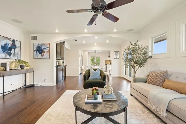 a living room with furniture or couch and a wooden floor