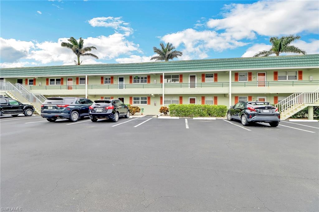 300 Valley Stream Drive, Unit A4 Naples, FL 34113 - Photo 1 of 25 a car parked in front of a building
