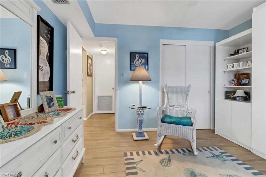 300 Valley Stream Drive, Unit A4 Naples, FL 34113 - Photo 16 of 25 a spacious bathroom with a granite countertop sink and a mirror