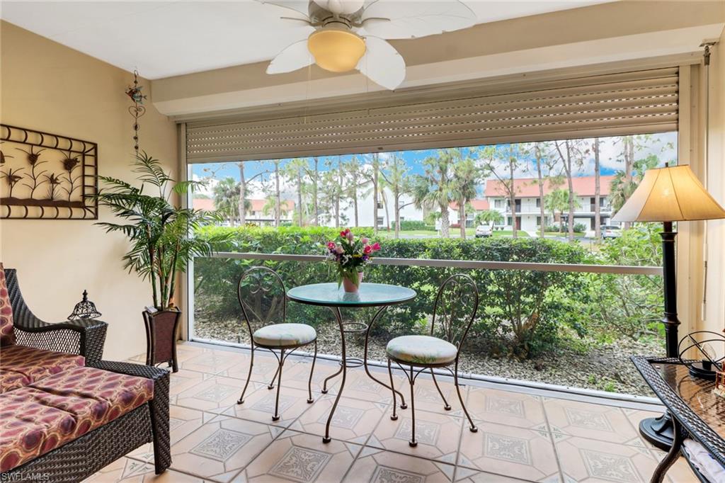 300 Valley Stream Drive, Unit A4 Naples, FL 34113 - Photo 20 of 25 a dining room with furniture and a window