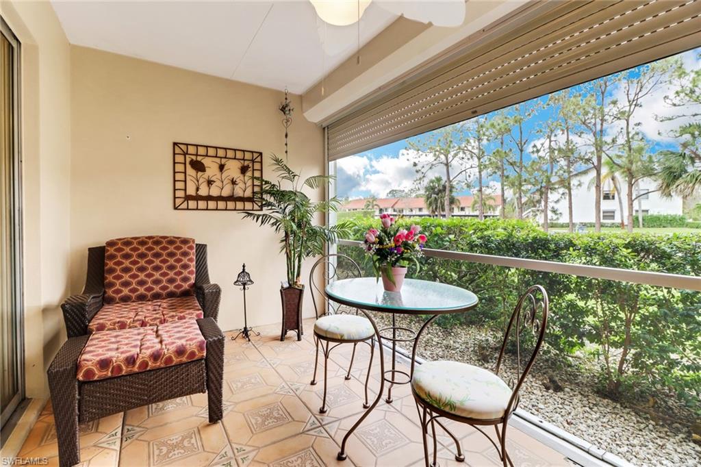 300 Valley Stream Drive, Unit A4 Naples, FL 34113 - Photo 21 of 25 a view of a dining room with furniture and a potted plant