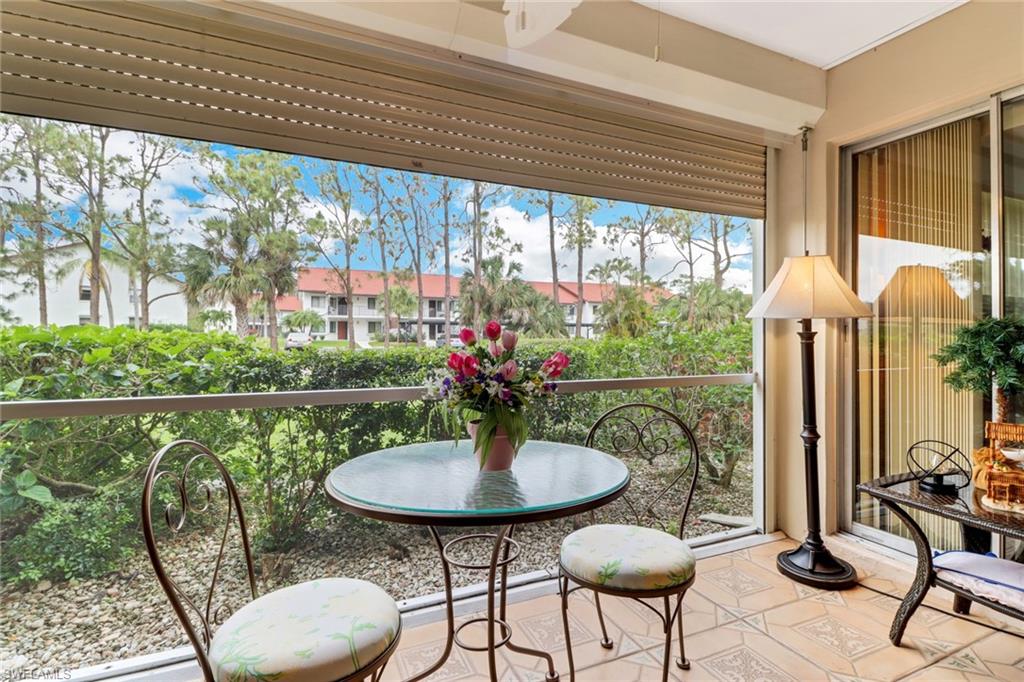 300 Valley Stream Drive, Unit A4 Naples, FL 34113 - Photo 22 of 25 a view of a dining room with furniture window and outside view