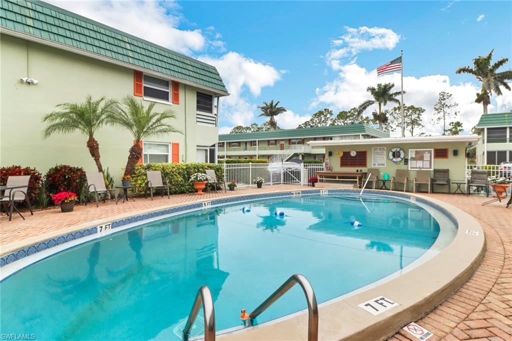 300 Valley Stream Drive, Unit A4 Naples, FL 34113 - Photo 24 of 25 a view of a swimming pool with a patio