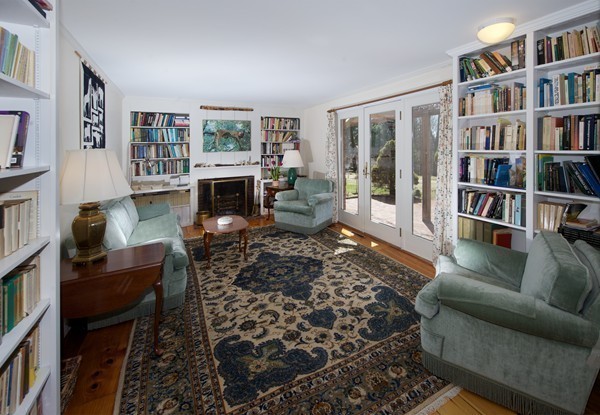 148 Still River Road Harvard, MA 01451 - Photo 17 of 29 a living room with furniture and a book shelf