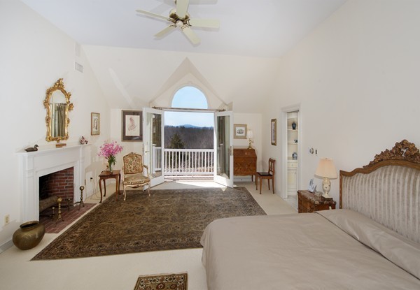 148 Still River Road Harvard, MA 01451 - Photo 19 of 29 a bedroom with a bed and a fireplace