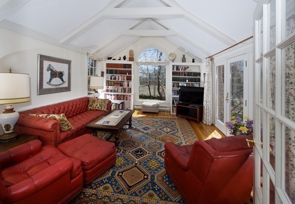 148 Still River Road Harvard, MA 01451 - Photo 7 of 29 a living room with furniture a flat screen tv and a fireplace