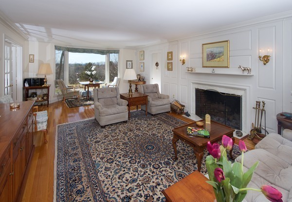 148 Still River Road Harvard, MA 01451 - Photo 8 of 29 a living room with furniture large window and a fireplace
